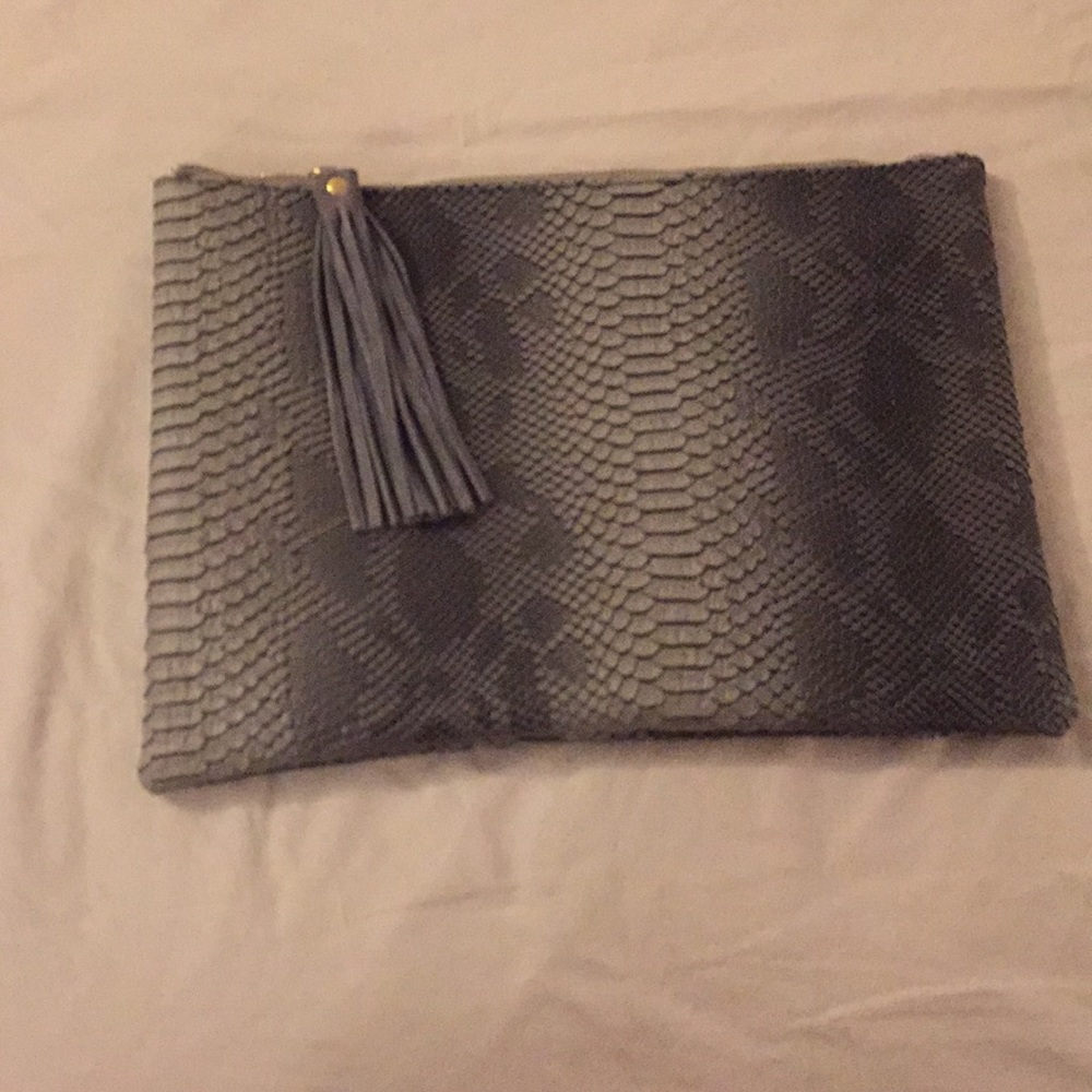 Faux snakeskin clutch with tassel zip